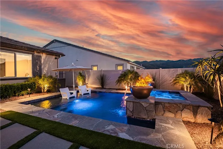 FIRE BOWLS ARE THE PERFECT ADDITION TO THIS STUNNING POOL