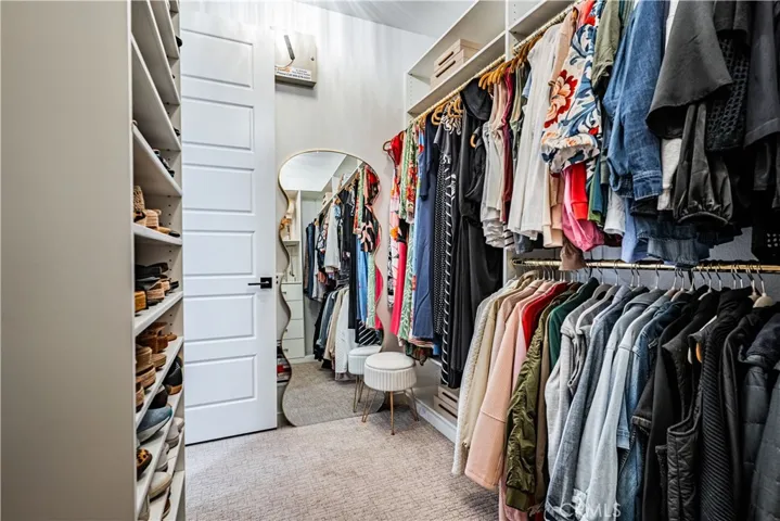 PRIMARY CLOSET W CUSTOM BUILT-INS
