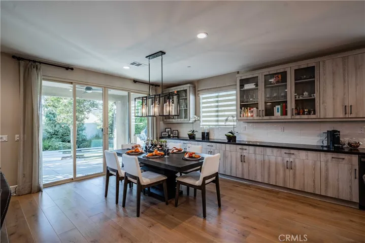 SPACIOUS DINING WITH PENDANT LIGHTING & AMPLE CABINETRY
