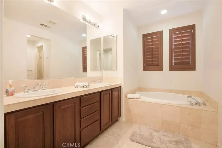 Primary bathroom with soaking tub and double sinks