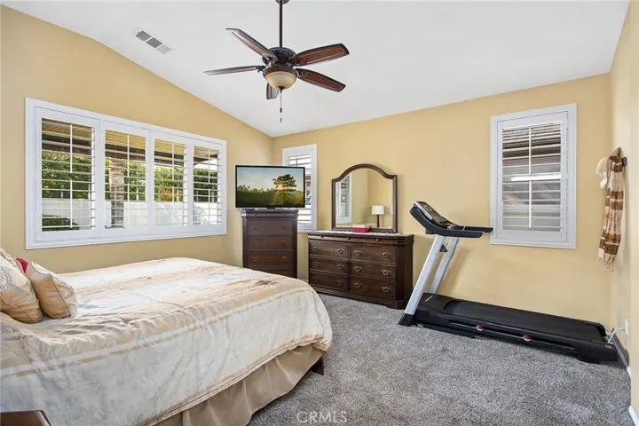 Master bedroom w/vaulted ceiling.
