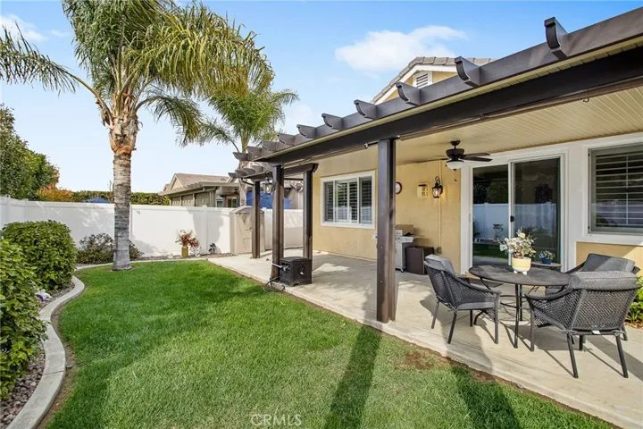 Covered patio a w/nice yard to enjoy.