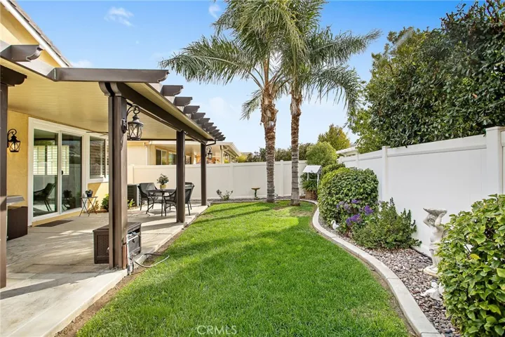 Covered patio a w/nice yard to enjoy.
