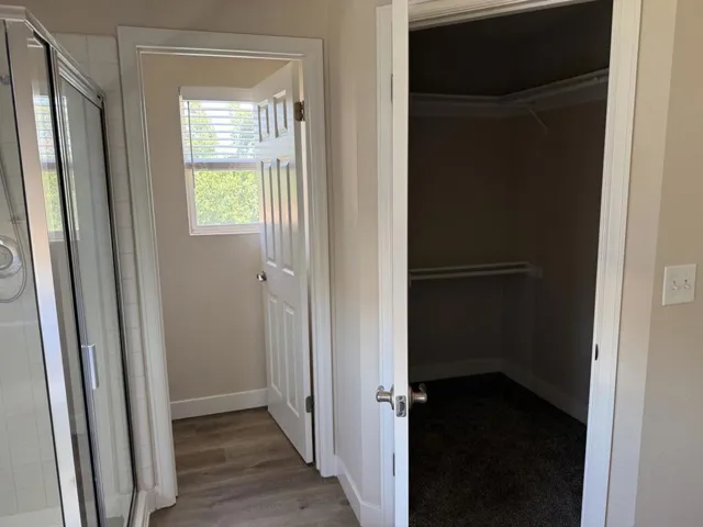 Primary walk in closet and private toilet area