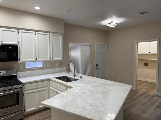 Kitchen and laundry room that goes into the garage