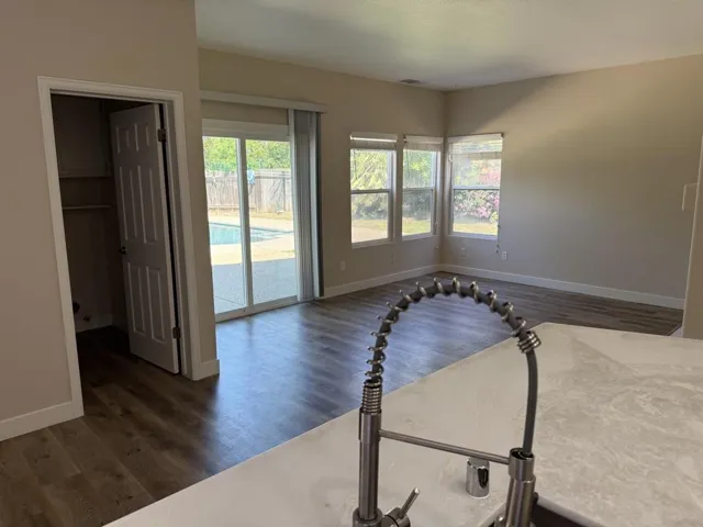 Breakfast nook and familyroom sliding door to backyard