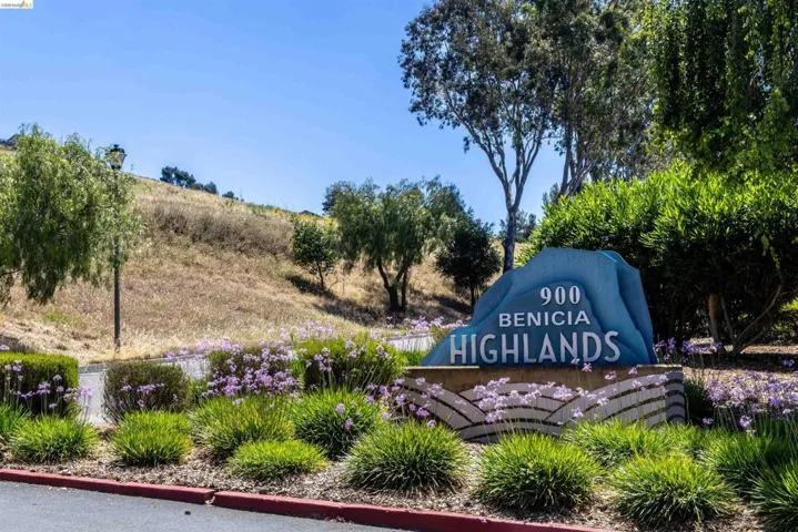 Sculpted signage for "900 Benicia Highlands" featuring a blue-toned, layered design