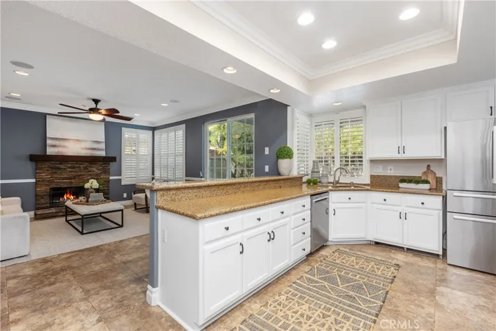 Kitchen open to family room with pool views
