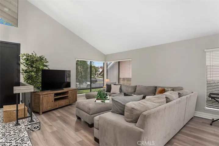 Spacious living room with gorgeous new flooring.
