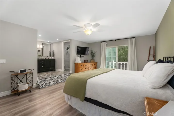 Large primary bedroom with newly remodeled bathroom & shower.