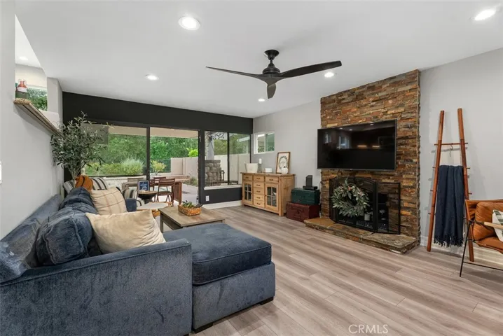 Family room with gas fireplace and slider to the backyard pool & spa area.