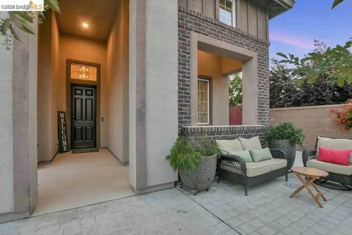 Entryway featuring a dark paneled door with transom window and a recessed ceiling light