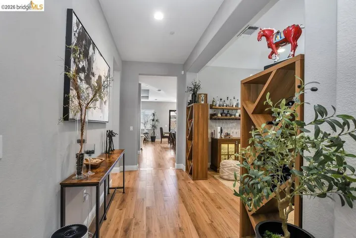 Hardwood-finish flooring extending through an open hallway