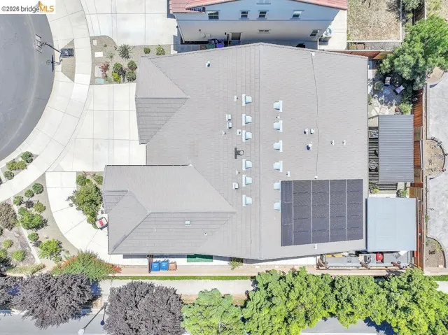 Gable roofline residence with integrated solar panel array