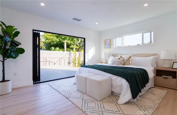 Primary suite with according door to deck