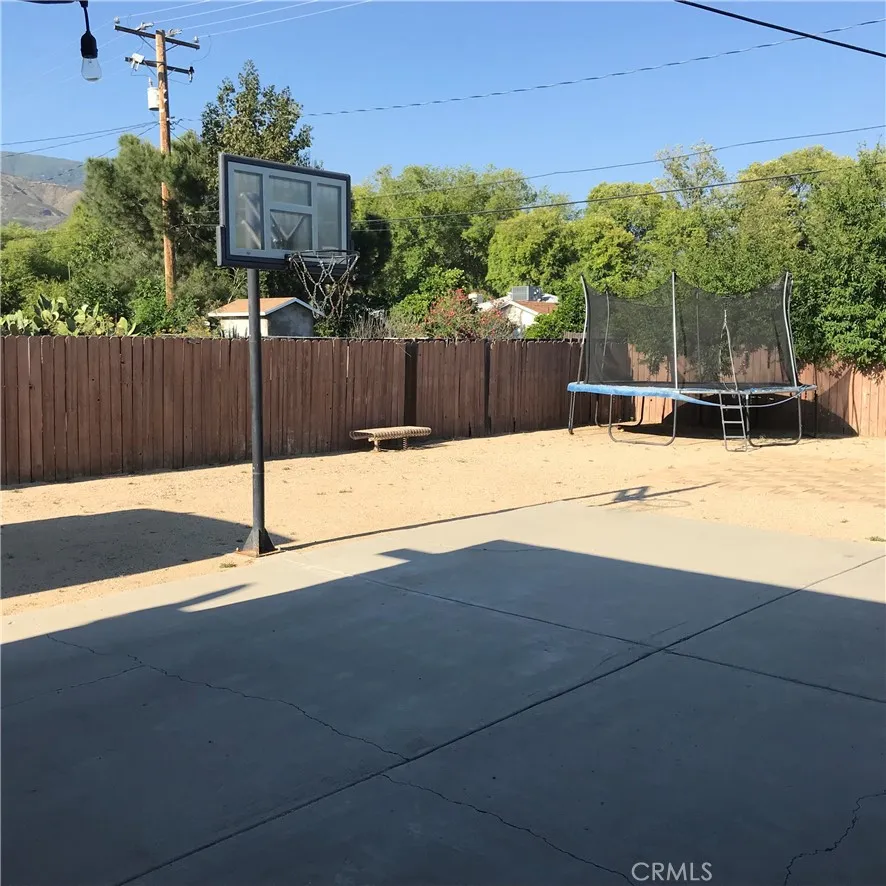 Spacious backyard. Basketball stand not included.