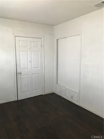 This door leads to the unpermitted space.