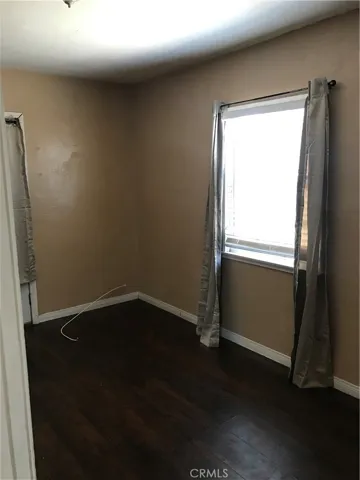 Bedroom that has back yard access.