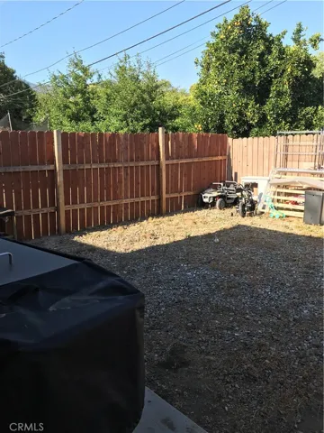 Behind the garage.