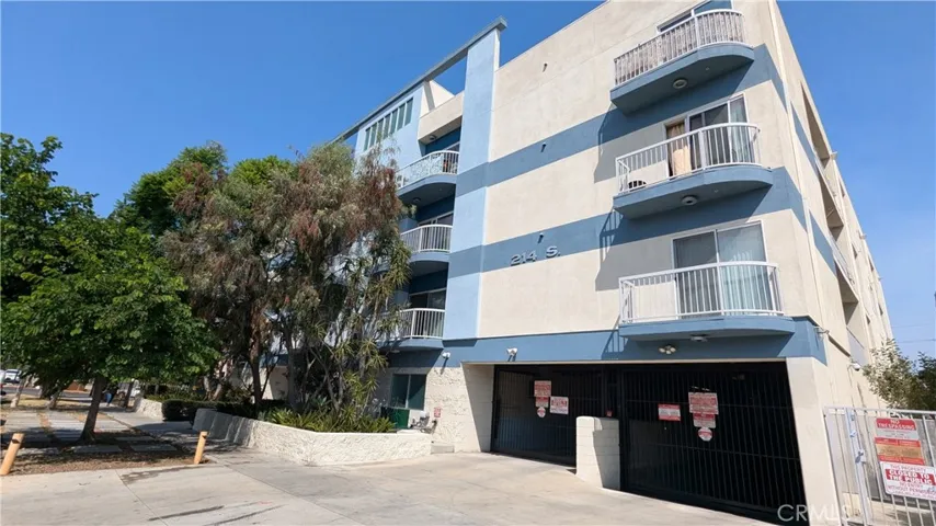 Front of the Building Complex and Gated Entrances into Building Garages