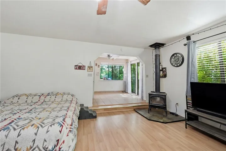 Bonus room features wood stove and mini split
