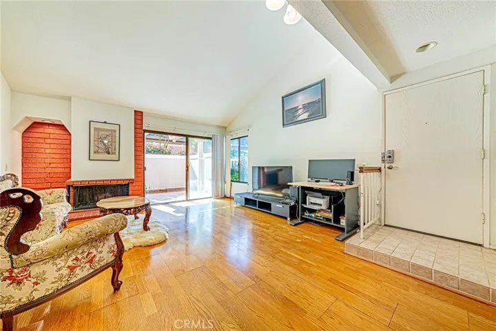Wood laminate flooring throughout the house