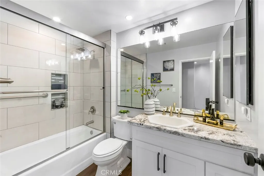 Secondary Bath and shower with custom tile work and custom cabinetry and counter fabrication.