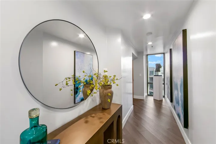 Enter from the left to elegant formal entry Hall that services all the rooms of the property. As u enter and turn to your left is window view toward Newport as you turn right takes you to the FLEX room secondary bathroom, kitchen, primary bedroom, main living space and private ocean view balcony.