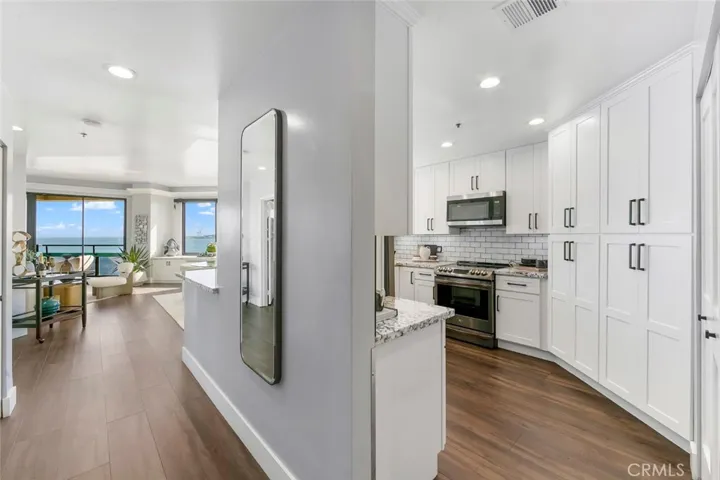 Main primary hallway gives you passage to your kitchen and formal living.