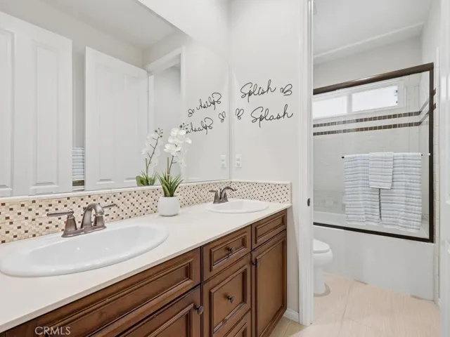 Secondary bathroom with dual sinks