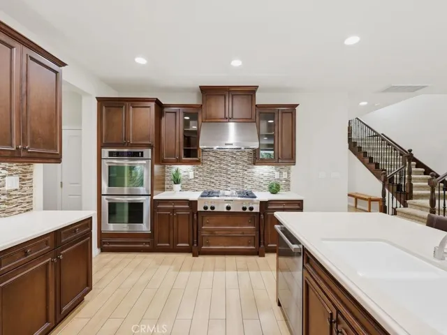 Double oven, gas stove top with grill and hood