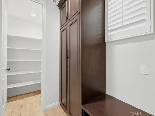 Walk-in pantry plus added cabinetry with pull-out drawers
