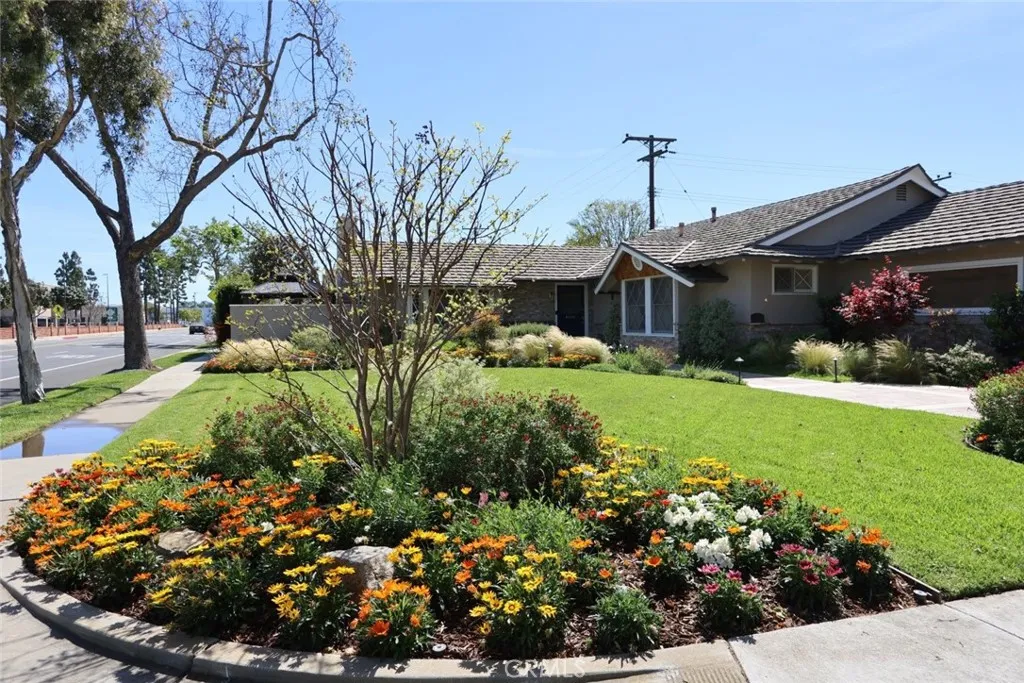 Enjoy the beautiful lush green front yard and walking distance to shopping, restaurants and the Rossmoor / Los Alamitos Library.