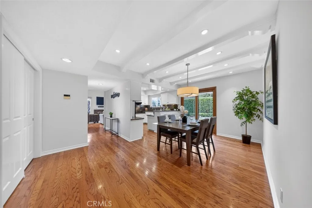 A wonderful Dining Room adjacent to the Kitchen with sliding wood door leading to the outdoor patio area.