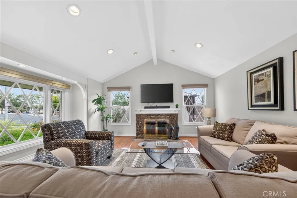 Living Room with wood burning marble fireplace for cozy evenings with family.