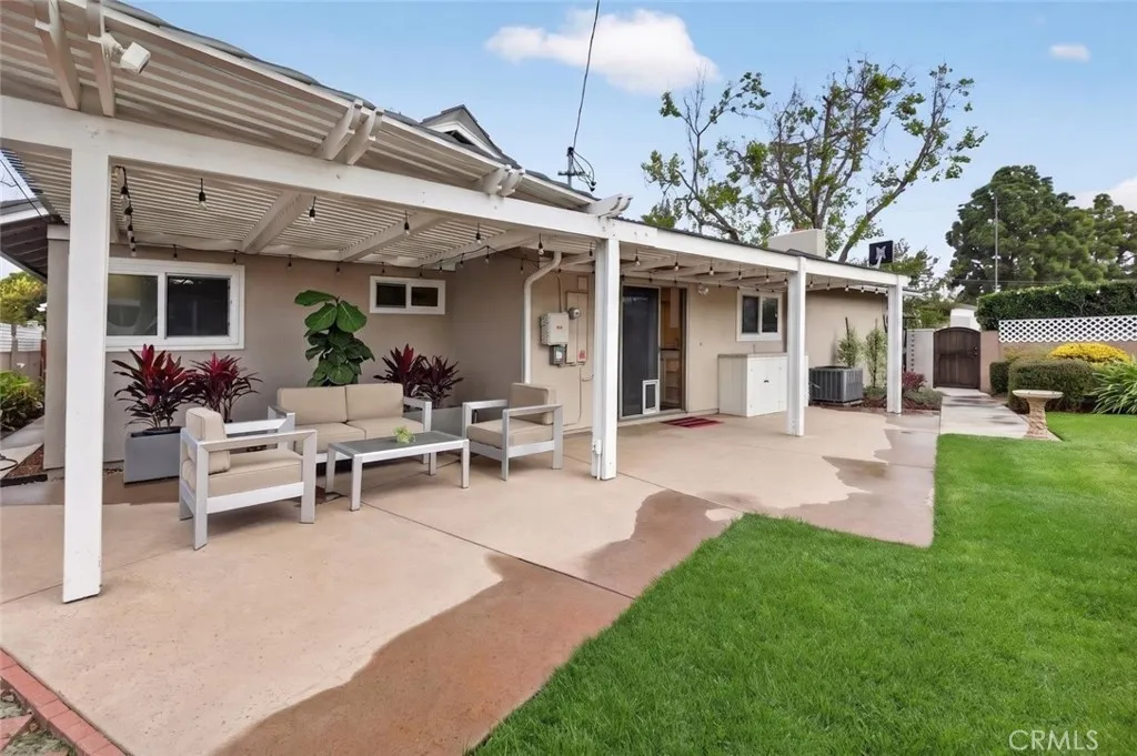 The spacious back yard is perfect for relaxing on sunny afternoons + hosting barbecues, + lovely patio, & plenty of outdoor living space.