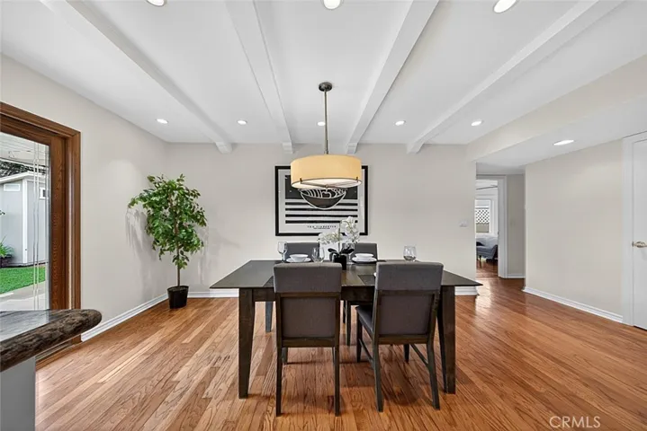 A wonderful Dining Room adjacent to the Kitchen with sliding wood door leading to the outdoor patio area.
