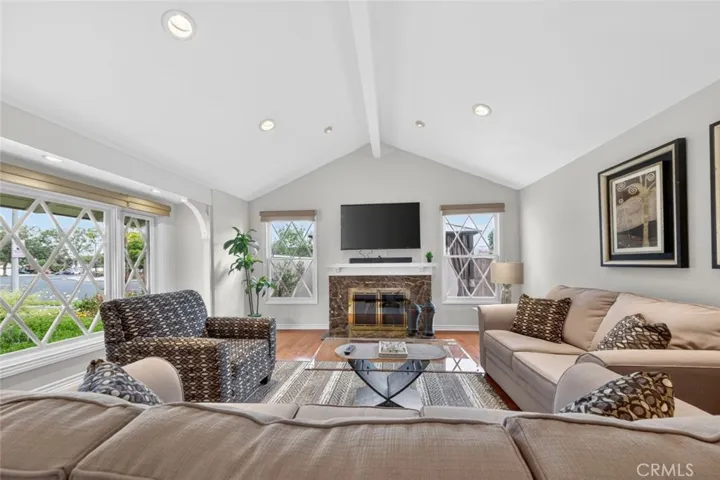 Living Room with wood burning marble fireplace for cozy evenings with family.
