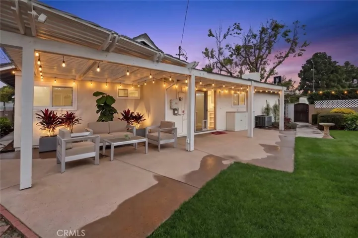 AI Enhanced. Relax and enjoy the green lush backyard with two patios and private spa.