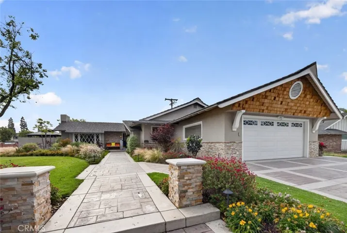 Amazing lush green front yard on large lot.