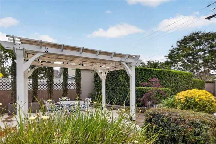 The spacious back yard is perfect for relaxing on sunny afternoons + hosting barbecues, + lovely patio, & plenty of outdoor living space.