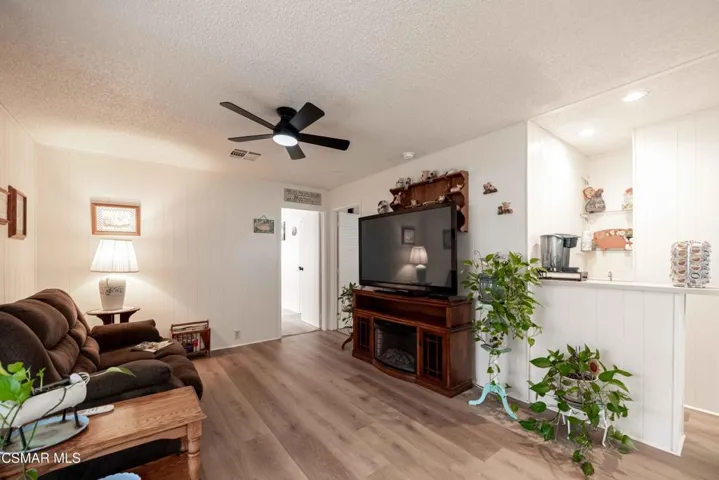 Den with fireplace & wet bar