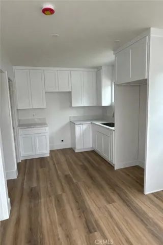 Stainless steel stove, refrigerator, microwave now installed along with white stackable washer & dryer