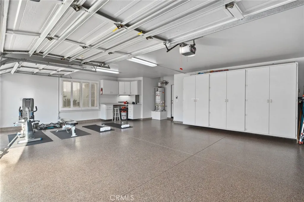 3 car garage-Epoxy floors, built ins, direct access to home and side yard