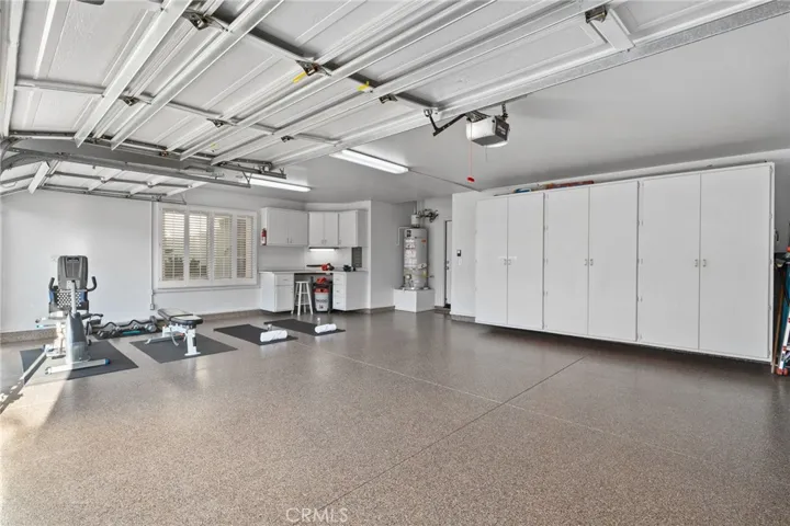3 car garage-Epoxy floors, built ins, direct access to home and side yard