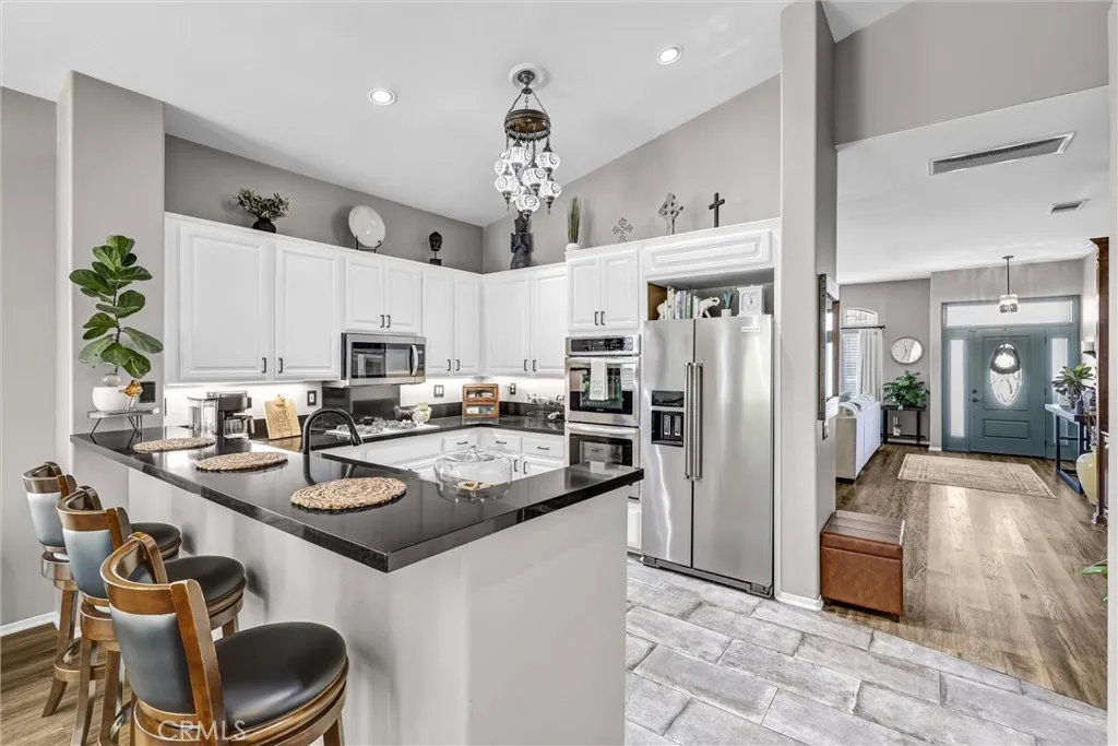 Breakfast Counter open to Family Room serves as a place to eat and area for entertaining