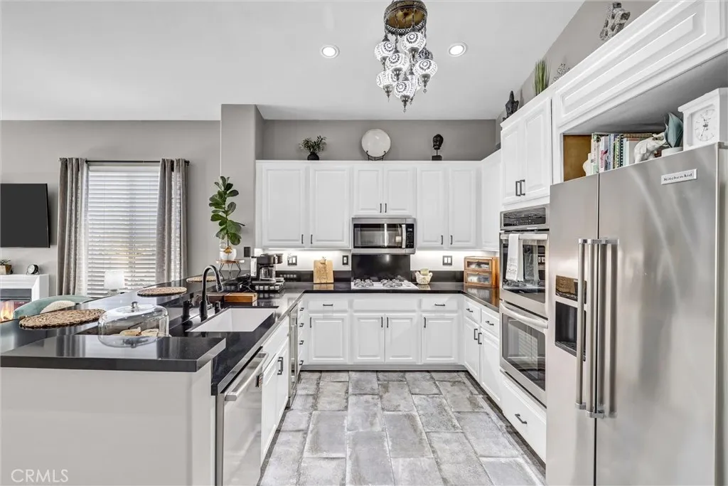 Enjoy the convenience of all the cabinets and counter space offered in this beautiful kitchen