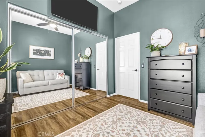 Secondary Guest Bedroom with mirrored wardrobe closet