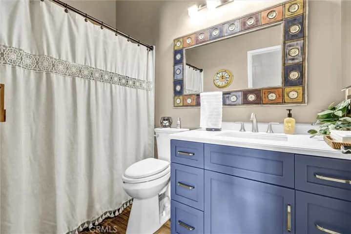 Hall Guest Bathroom with Shower in Tub and newer vanity