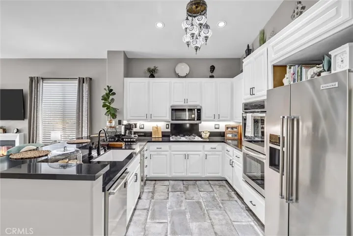 Enjoy the convenience of all the cabinets and counter space offered in this beautiful kitchen